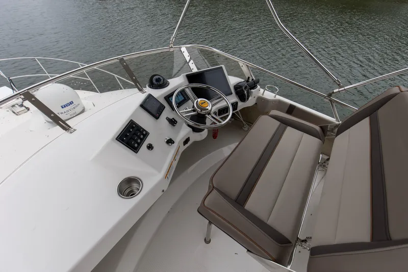 Slide: The Image of 2021 Cutwater C-32 CB helm with dual seats and navigation controls. - 41