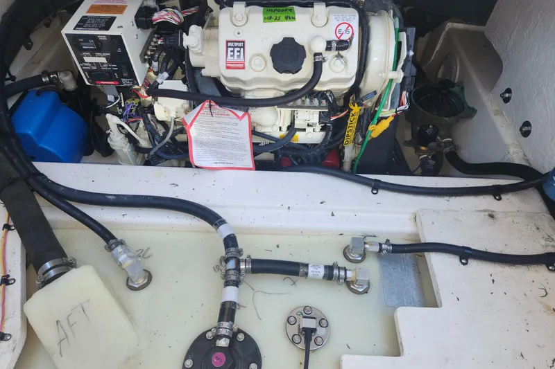 Slide: The Image of Engine compartment of a 2021 Cutwater C-32 CB boat, showcasing wiring and components. - 52