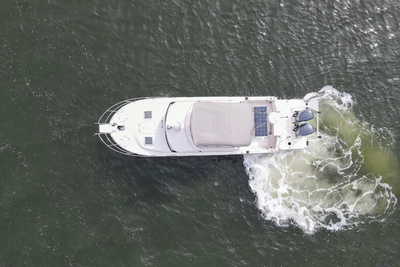 Slide: The Image of Aerial view of 2021 Cutwater C-32 CB boat cruising on water. - 69