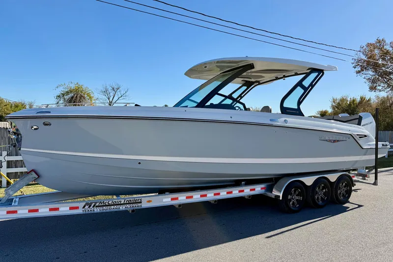 The Image of 2026 Monterey Elite 30 OB boat on trailer. - 1