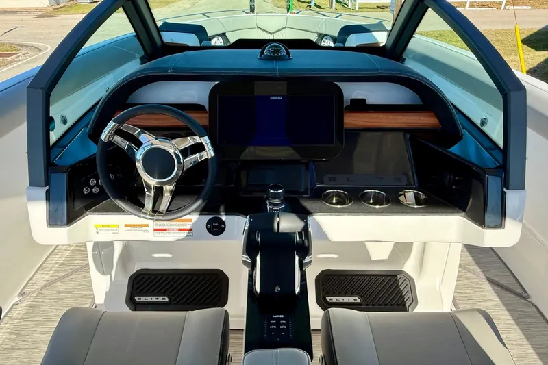 Slide: The Image of Interior view of the 2026 Monterey Elite 30 OB boat cockpit. - 12