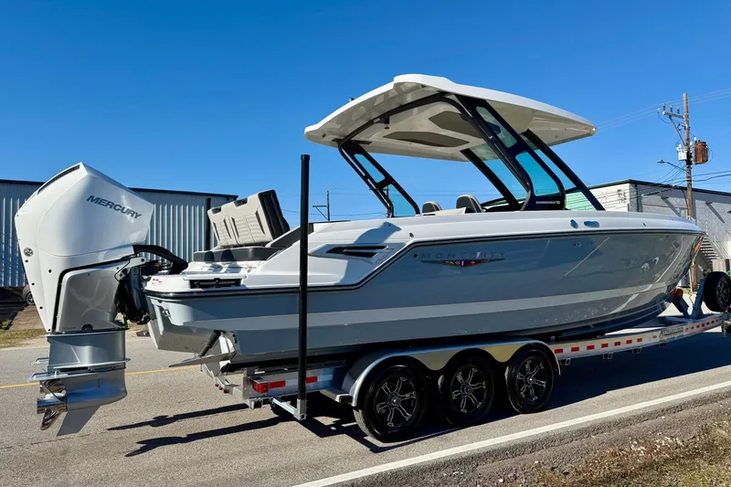 Slide: The Image of 2026 Monterey Elite 30 OB boat on trailer, side view. - 4