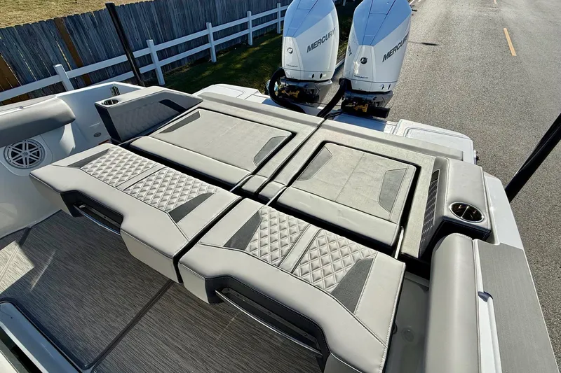 Slide: The Image of 2026 Monterey Elite 30 OB boat with luxurious seating area. - 9