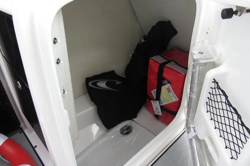 Slide: The Image of Storage compartment in 2025 Yamaha AR250 boat with safety gear and equipment. - 13