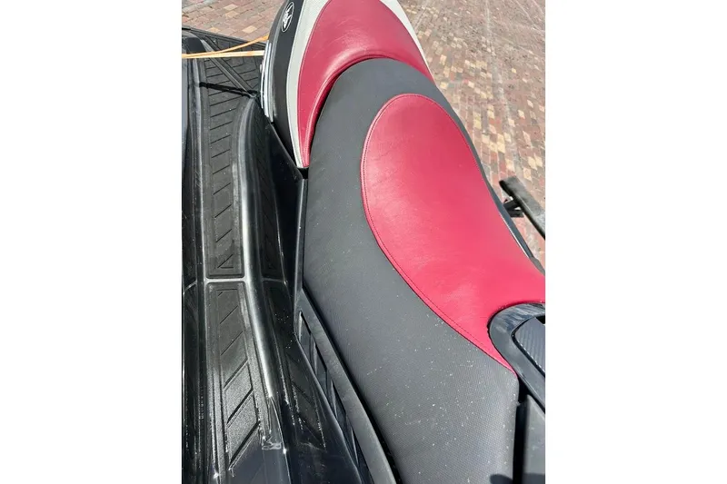 Slide: The Image of 2006 Sea-Doo RXT jet ski seat with red and black design. - 6