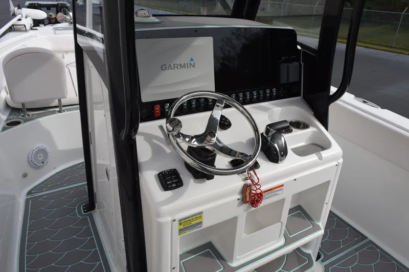 Slide: The Image of 2021 Sea Hunt Ultra 255 SE boat console with Garmin navigation system. - 11