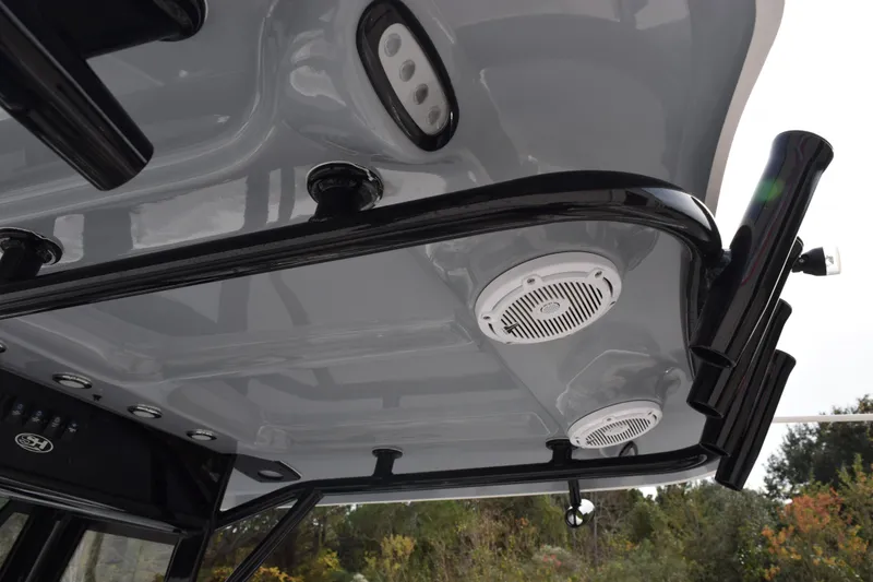 Slide: The Image of 2021 Sea Hunt Ultra 255 SE boat interior with speakers and lighting fixtures. - 13