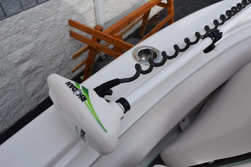 Slide: The Image of 2021 Sea Hunt Ultra 255 SE boat with a mounted trolling motor. - 22