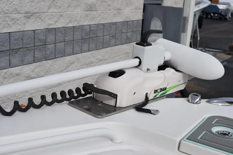 Slide: The Image of 2021 Sea Hunt Ultra 255 SE boat with Rhodan trolling motor mounted on deck. - 23