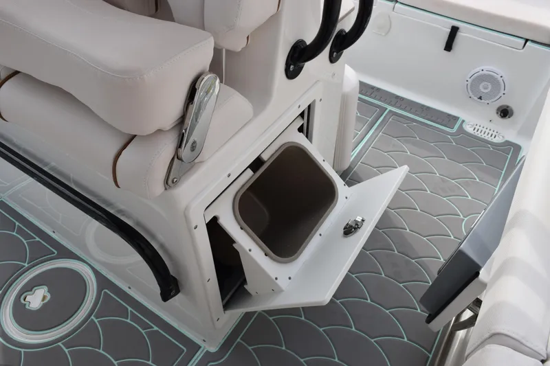 Slide: The Image of 2021 Sea Hunt Ultra 255 SE boat interior with open storage compartment and stylish flooring. - 24