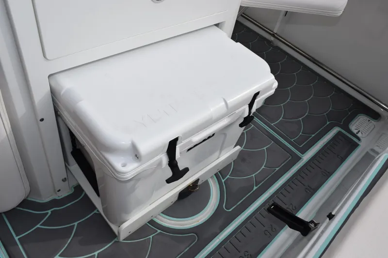 Slide: The Image of 2021 Sea Hunt Ultra 255 SE boat with cooler and custom flooring. - 27