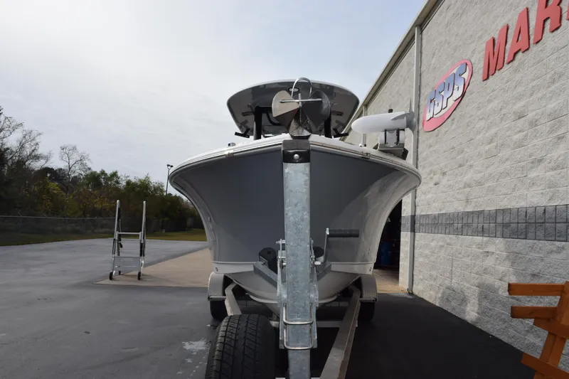 Slide: The Image of 2021 Sea Hunt Ultra 255 SE boat on trailer outside marine store. - 3