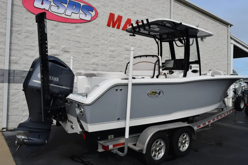Slide: The Image of 2021 Sea Hunt Ultra 255 SE boat on trailer, displayed outside dealership. - 4