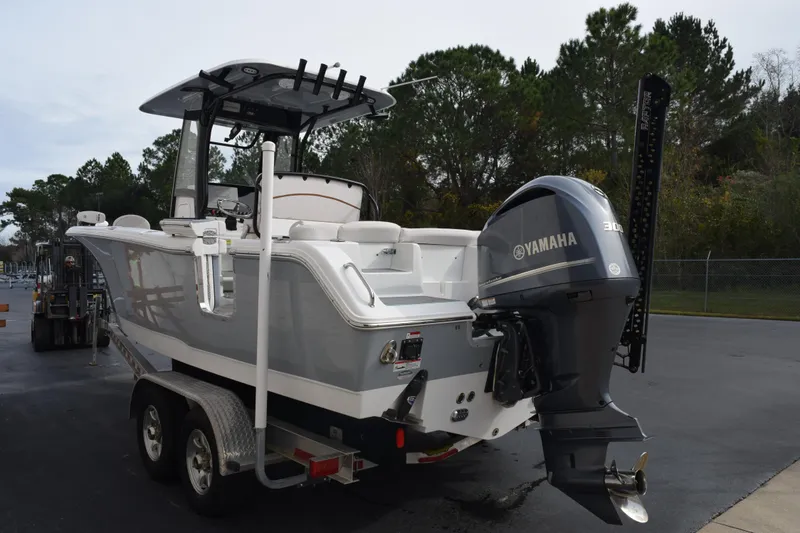 Slide: The Image of 2021 Sea Hunt Ultra 255 SE boat with Yamaha 300 engine on trailer. - 6