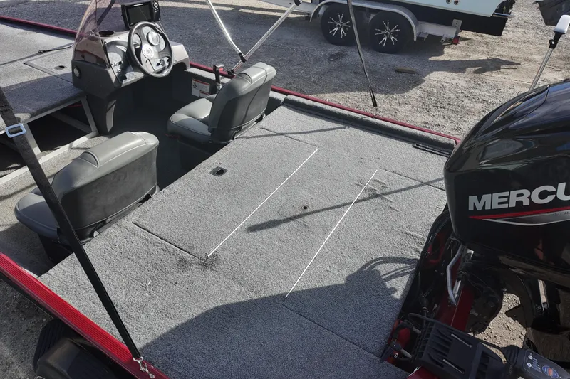 Slide: The Image of 2020 Bass Tracker Classic XL boat interior with Mercury engine, featuring dual seats and steering console. - 11