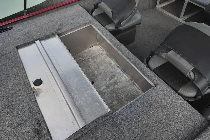 Slide: The Image of 2020 Bass Tracker Classic XL boat interior with storage compartment and seating. - 12