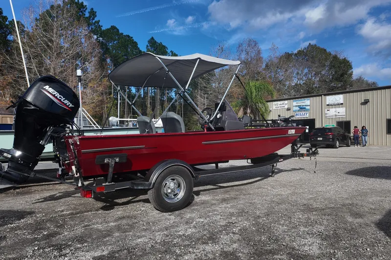 Slide: The Image of 2020 Bass Tracker Classic XL boat with Mercury engine on trailer, parked outdoors. - 3