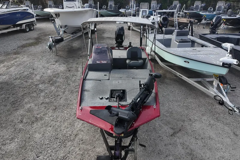 Slide: The Image of 2020 Bass Tracker Classic XL boat in a marina, surrounded by other boats. - 5