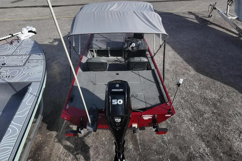 Slide: The Image of 2020 Bass Tracker Classic XL boat with Mercury 50 engine, covered seating, and gray canopy. - 7