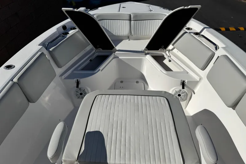 Slide: The Image of 2021 Sea Fox 268 Commander boat interior with open storage compartments and cushioned seating. - 15