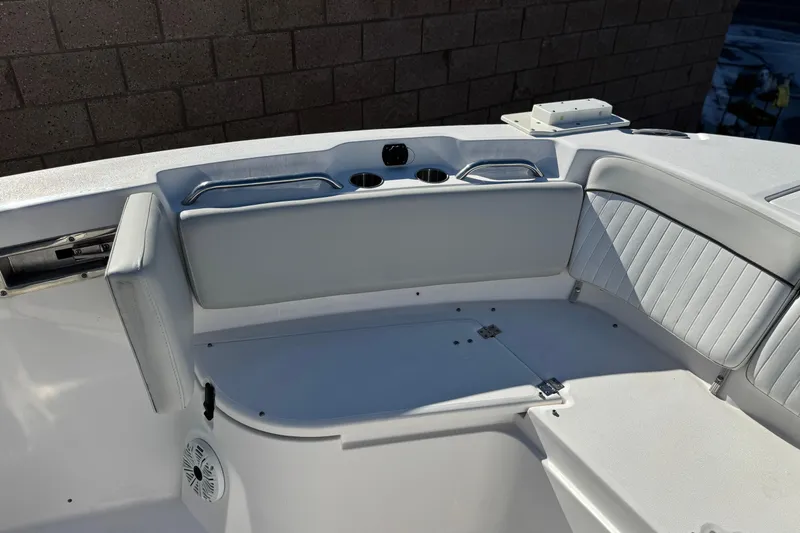 Slide: The Image of 2021 Sea Fox 268 Commander boat interior with cushioned seating and cup holders. - 17