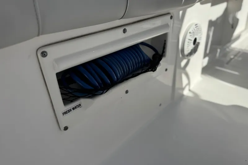 Slide: The Image of Freshwater hose compartment on 2021 Sea Fox 268 Commander boat. - 24