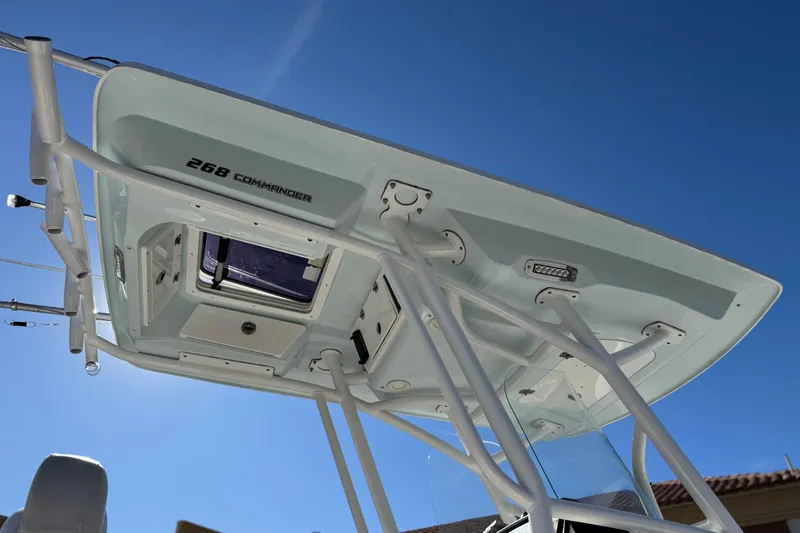 Slide: The Image of 2021 Sea Fox 268 Commander boat T-top against clear blue sky. - 27