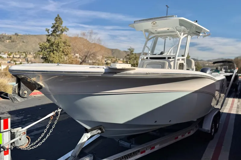 Slide: The Image of 2021 Sea Fox 268 Commander boat on trailer, scenic background. - 3