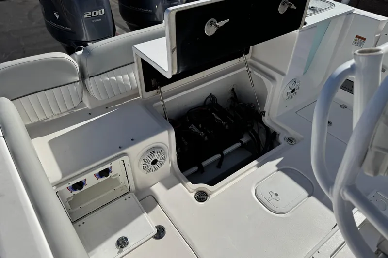 Slide: The Image of 2021 Sea Fox 268 Commander boat interior with open storage compartment and Yamaha engines. - 37