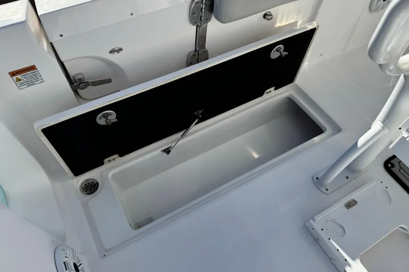 Slide: The Image of Open storage compartment on a 2021 Sea Fox 268 Commander boat. - 41