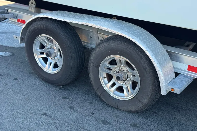Slide: The Image of Trailer wheels of a 2021 Sea Fox 268 Commander boat on pavement. - 53