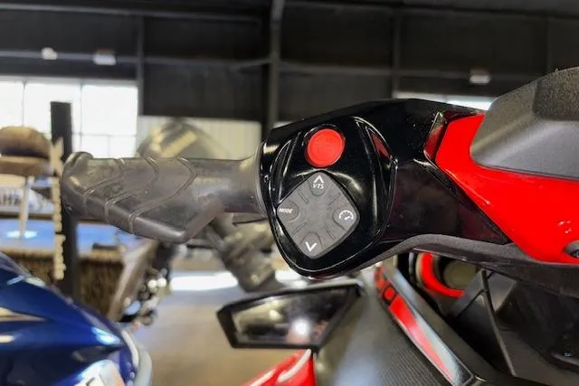 Slide: The Image of Close-up of 2020 Sea-Doo RXT-X 300 handlebar controls in a showroom. - 19