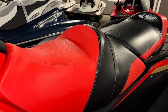 Slide: The Image of 2020 Sea-Doo RXT-X 300 jet ski with red and black seat design. - 6