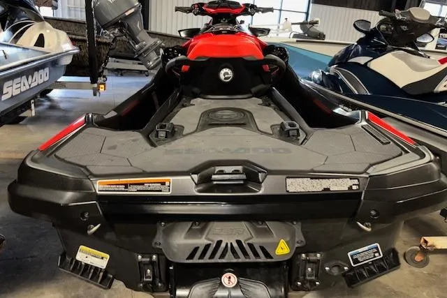 Slide: The Image of 2020 Sea-Doo RXT-X 300 jet ski in a showroom, rear view. - 7