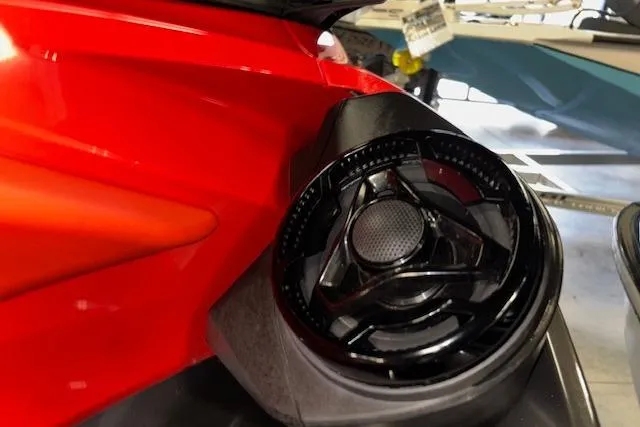 Slide: The Image of Close-up of a 2020 Sea-Doo RXT-X 300 speaker detail in a vibrant red finish. - 9