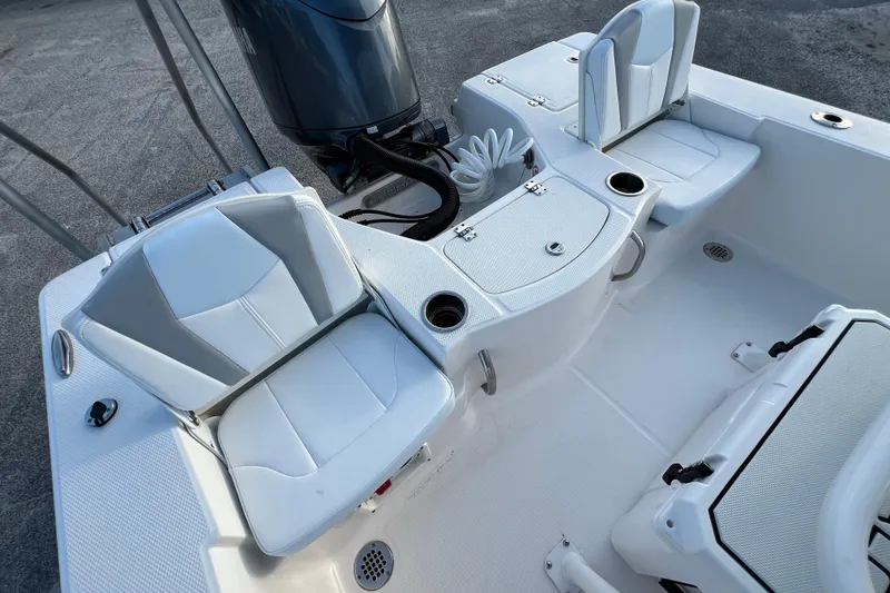 Slide: The Image of 2024 Robalo 206 Cayman boat interior with seating and storage compartments. - 10