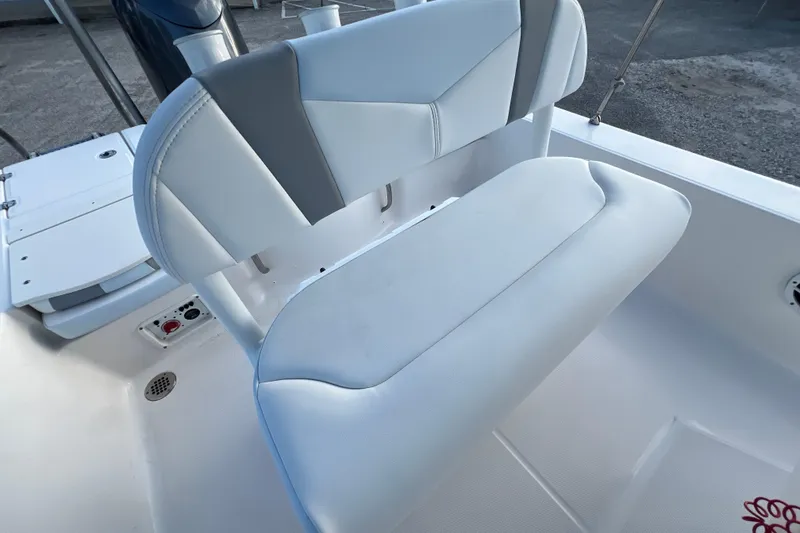 Slide: The Image of 2024 Robalo 206 Cayman boat seat with white and gray upholstery. - 13