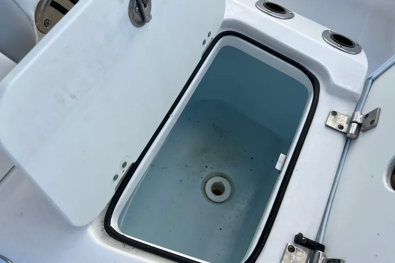 Slide: The Image of Open storage compartment on 2024 Robalo 206 Cayman boat. - 16