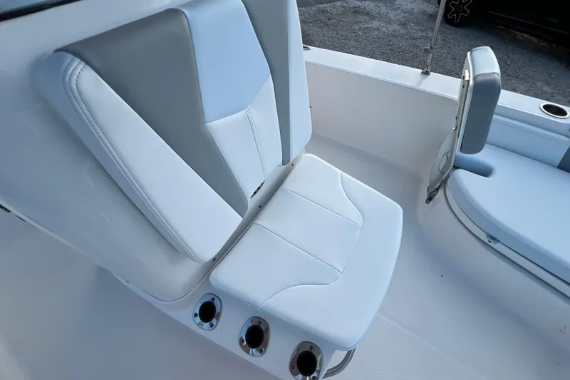 Slide: The Image of 2024 Robalo 206 Cayman boat seat with white and gray upholstery. - 17