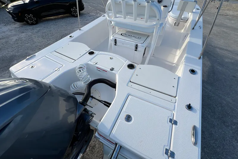 Slide: The Image of 2024 Robalo 206 Cayman boat interior with storage compartments and seating. - 9