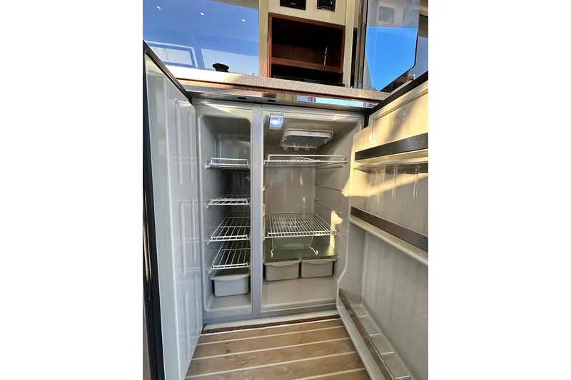Slide: The Image of Open refrigerator inside the galley - 11
