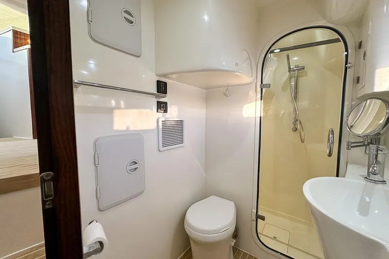 Slide: The Image of Port side head with shower, toilet, and sink - 17