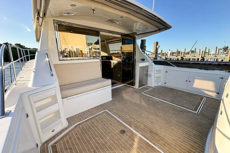 Slide: The Image of Spacious cockpit with large in floor storage lockers, exterior refrigerator, seating, under seat storage, and a retractable shade - 24