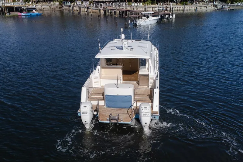 Slide: The Image of Cockpit and stern view of the ArrowCat 420 Coupe - 5