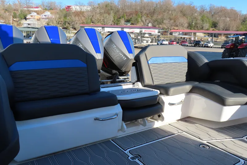 Slide: The Image of 2021 Sunsation Powerboats 40CCX interior with blue-accented seating and powerful outboard engines. - 12