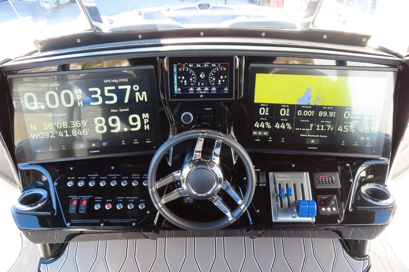Slide: The Image of 2021 Sunsation Powerboats 40CCX dashboard with advanced navigation and control systems. - 14