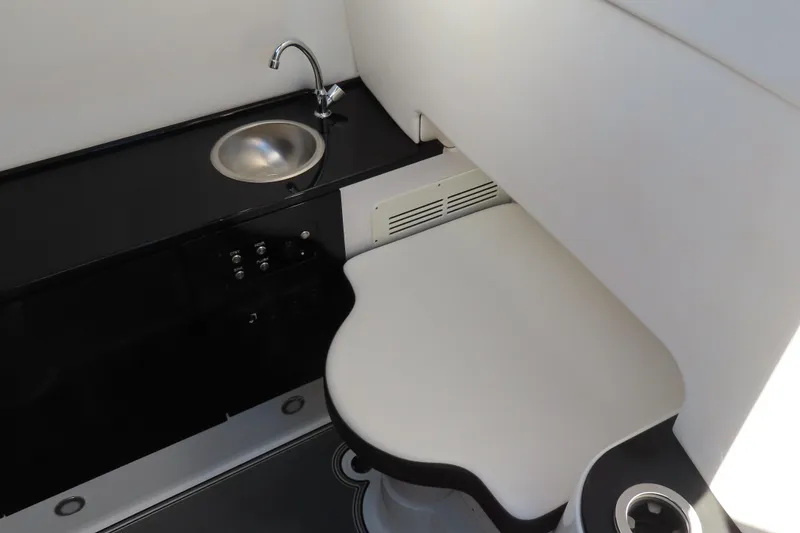 Slide: The Image of 2021 Sunsation Powerboats 40CCX interior with sink and seating area. - 8
