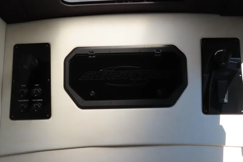 Slide: The Image of 2021 Sunsation Powerboats 40CCX dashboard with control panels and logo. - 9