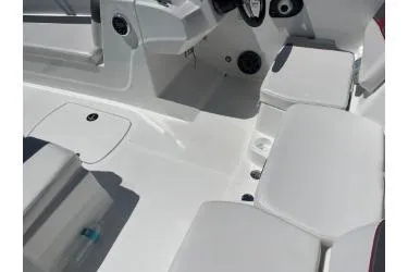 Slide: The Image of 2024 Tahoe T18 boat interior with white seating and modern dashboard design. - 2