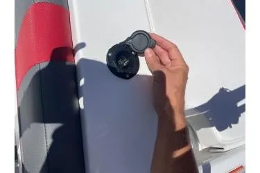 Slide: The Image of 2024 Tahoe T18 boat seat with a person holding a cup holder. - 5